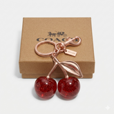 COACH Cherry Bag Charm in Rose Gold-Tone with Glazed Resin – Luxury Purse Accessory